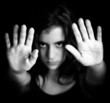 Girl with hands signaling to stop in black and white