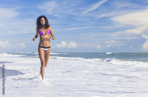 Photo: Sexy Bikini Woman Girl Running on Beach Sexy Bikini Woman Girl Running on Beach