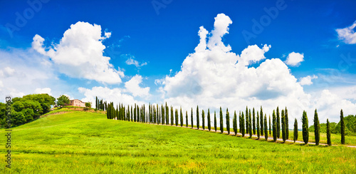 Photo: Beautiful landscape with house on hill in Tuscany, Italy Beautiful landscape with house on hill in Tuscany, Italy