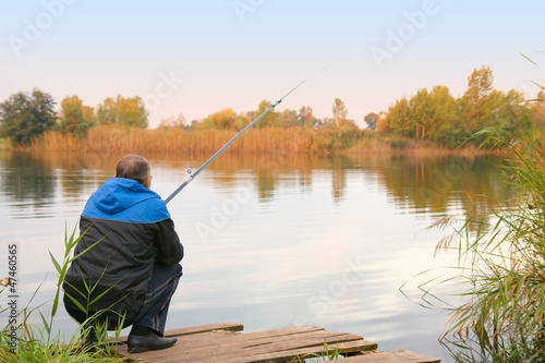 Photo: man fishing on the lake man fishing on the lake