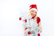 beautiful blonde woman holding a christmas gift is smiling