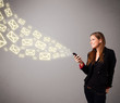 attractive young lady holding a phone with message icons