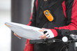 Female Cyclist Holding Courier Package