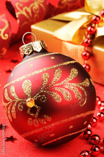 Photo: Christmas ball on festive background Christmas ball on festive background