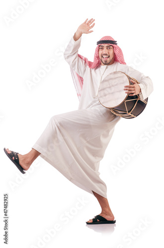 Photo: Arab man playing drum isolated on white Arab man playing drum isolated on white
