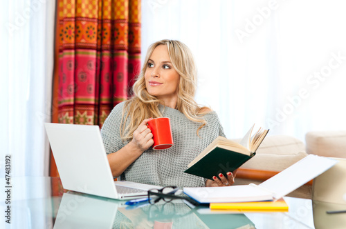 Photo: woman working on laptop at home woman working on laptop at home