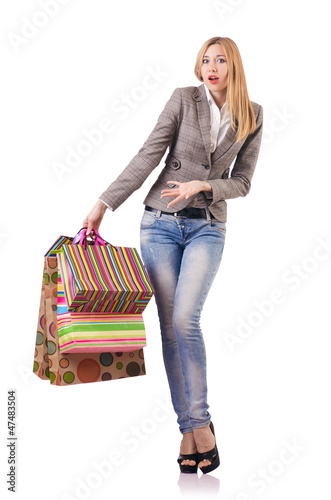 Photo: Attractive woman after christmas shopping on white Attractive woman after christmas shopping on white