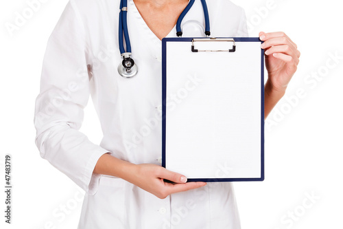 Photo: medical female doctor holding blank billboard isolated on white medical female doctor holding blank billboard isolated on white