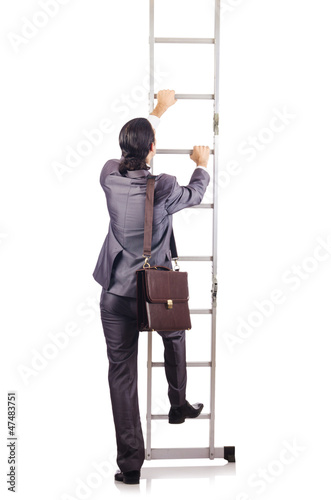 Photo: Businessman climbing the ladder isolated on white Businessman climbing the ladder isolated on white