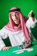 Arab playing in casino - gambling concept with man