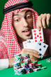 Arab playing in casino - gambling concept with man