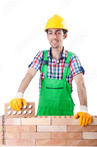 Photo: Builder with hard hat on white Builder with hard hat on white