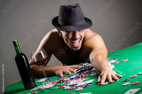 Photo: Naked broke businessman in casino Naked broke businessman in casino