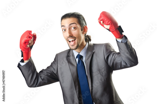 Photo: Businessman with boxing gloves on white Businessman with boxing gloves on white