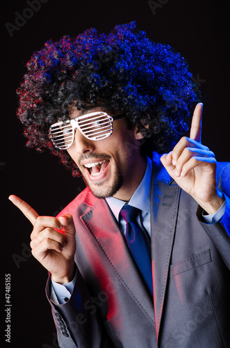 Photo: Singer with afro cut in dark studio Singer with afro cut in dark studio