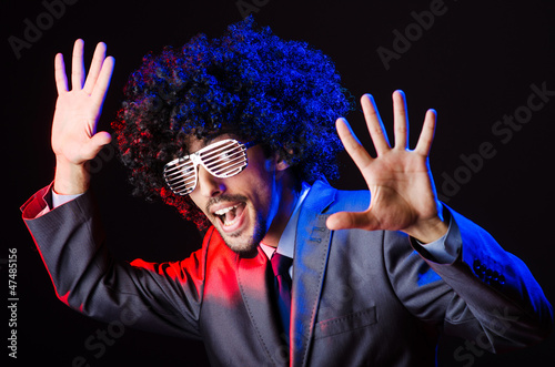 Photo: Singer with afro cut in dark studio Singer with afro cut in dark studio