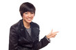 Happy Young Mixed Race Woman Pointing to the Side