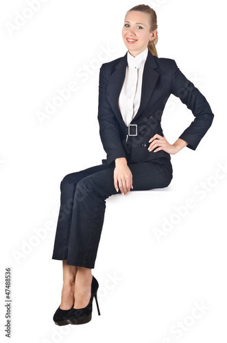 Photo: Woman businesswoman sitting on virtual wall Woman businesswoman sitting on virtual wall