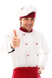 Young and handsome cook showing thumbs up