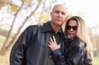 Attractive Couple in Park with Leather Jackets