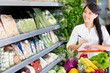 Woman shopping with a list