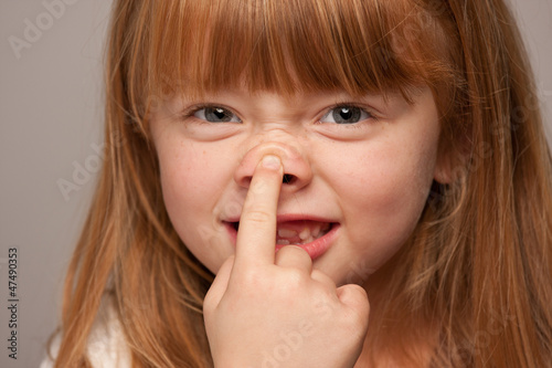 Photo: Fun Portrait of an Adorable Red Haired Girl on Grey Fun Portrait of an Adorable Red Haired Girl on Grey