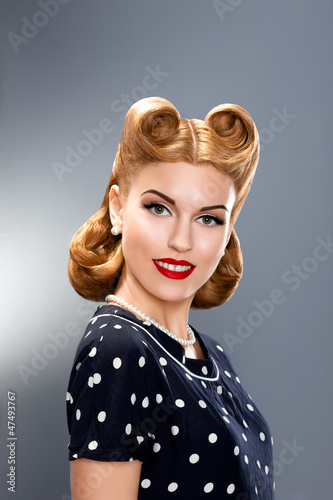 Photo: Pin-up Style. Styled Fashion Model in Retro Dress - Glamour Pin-up Style. Styled Fashion Model in Retro Dress - Glamour