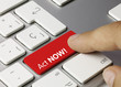 Act NOW! keyboard key. Finger