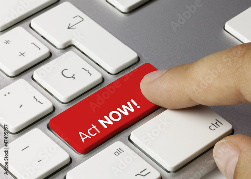 Photo: Act NOW! keyboard key. Finger Act NOW! keyboard key. Finger