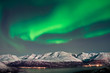 Northern lights over fjords in Norway
