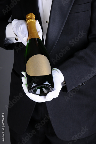 Photo: Sommelier Presenting Champagne Bottle Sommelier Presenting Champagne Bottle