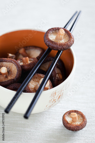 Photo: Soaked shiitake mushrooms in bowl, selective focus Soaked shiitake mushrooms in bowl, selective focus