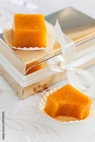 Photo: Fruit jelly candy with vanilla and gift box, selective focus Fruit jelly candy with vanilla and gift box, selective focus