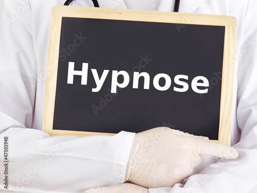 Photo: Doctor shows information on blackboard: hypnosis Doctor shows information on blackboard: hypnosis