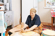 Photo: Senior woman holing the bread Senior woman holing the bread