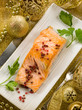 Photo: grilled salmon with pink pepper on christmas table grilled salmon with pink pepper on christmas table