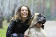 Foto: Smiling girl with a dog Smiling girl with a dog