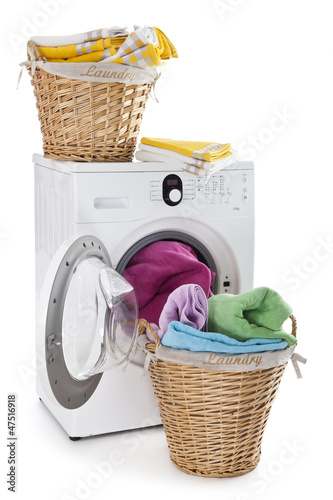 Photo: Laundry basket on a washing machine isolated on white background Laundry basket on a washing machine isolated on white background