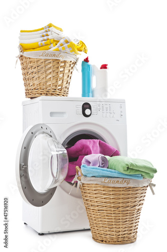 Photo: Laundry baskets and washing machine isolated on white background Laundry baskets and washing machine isolated on white background