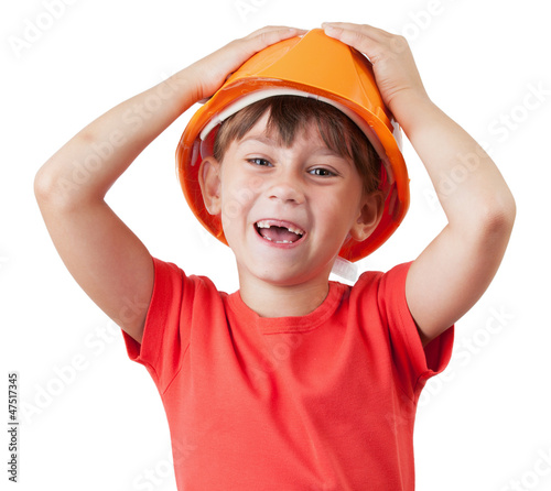 Photo: Little girl in the construction of protective helmet Little girl in the construction of protective helmet