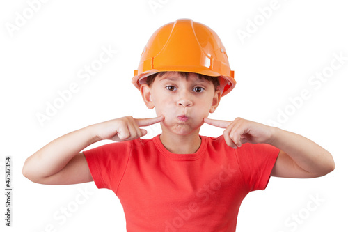 Photo: Girl in an helmet presses his fingers on the cheeks Girl in an helmet presses his fingers on the cheeks