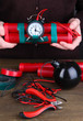 Human makes timebomb on wooden table on black background
