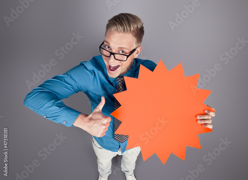 Photo: Salesman with thumbs up and empty sign promoting sales. Salesman with thumbs up and empty sign promoting sales.