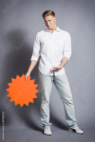 Photo: Man showing empty signboard with space for text. Man showing empty signboard with space for text.