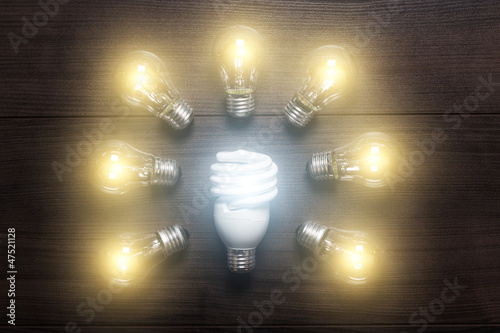 Photo: energy saving lamp with glow lamps comparison concept energy saving lamp with glow lamps comparison concept
