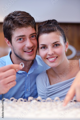 Photo: happy young couple in jewelry store happy young couple in jewelry store
