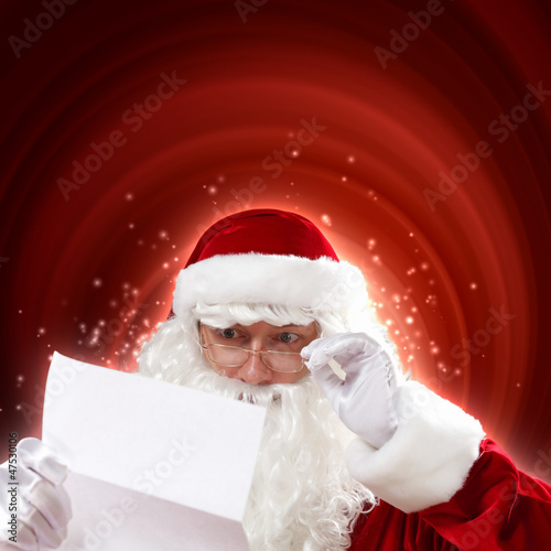 Photo: Santa with christmas letter Santa with christmas letter