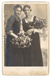 portrait of two young women with flowers