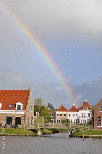 Photo: Dutch small village with rainbow Dutch small village with rainbow