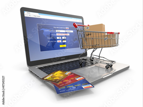 Illustration: E-commerce. Shopping cart and credit cards on laptop E-commerce. Shopping cart and credit cards on laptop